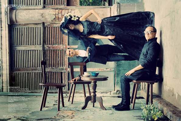 Inception inspired anti gravity image with two men and a woman in black clothes