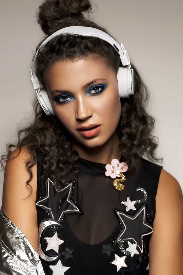 female white headset, blue eye shadow and black star top