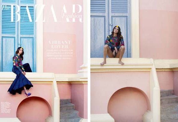 Fashion model sitting against colourful walls